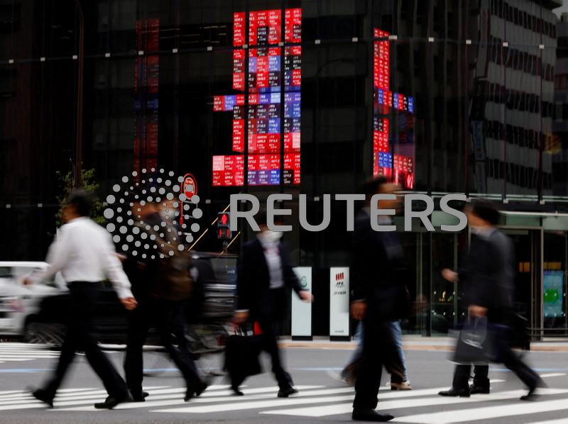Japan keeps economic recovery view, flags US policy risks