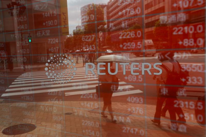 Asian stocks slide amid Trump tariff worries, yen gains