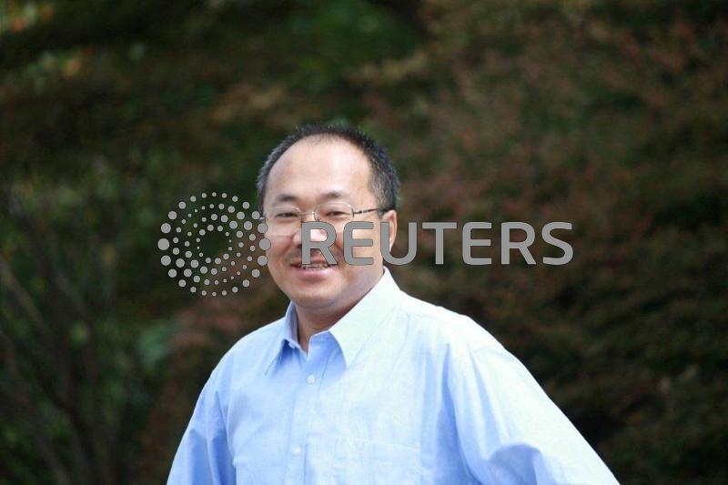 China court jails journalist for seven years on spy charges, family says
