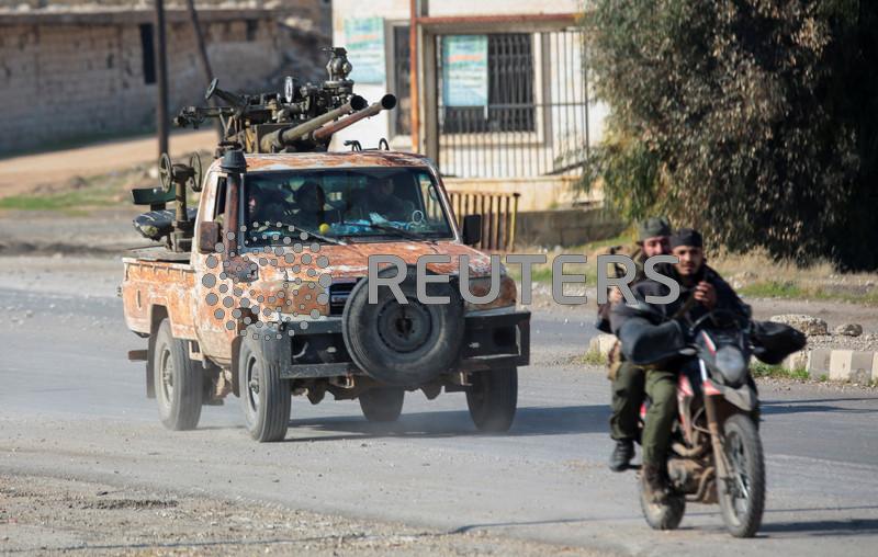 As Syrian rebels sweep into Aleppo, army closes airport and roads, sources say