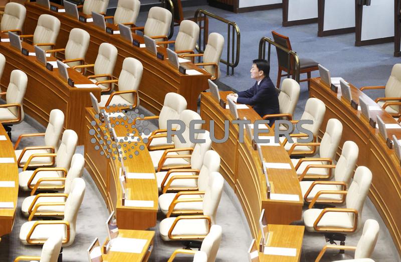 Shouting, curses as South Korean president's party boycotts martial law impeachment vote