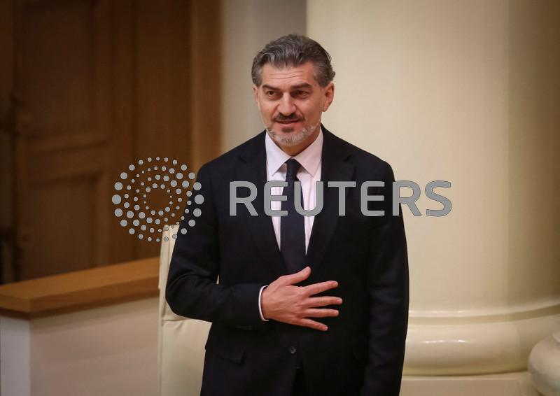 New Georgian president sworn in; predecessor says he is not legitimate leader