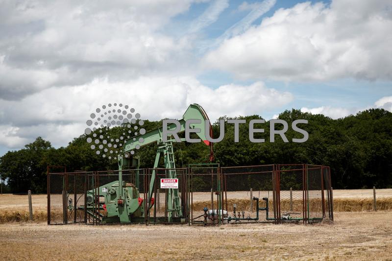 Oil inches higher in thin trade, investors focus on China, US data