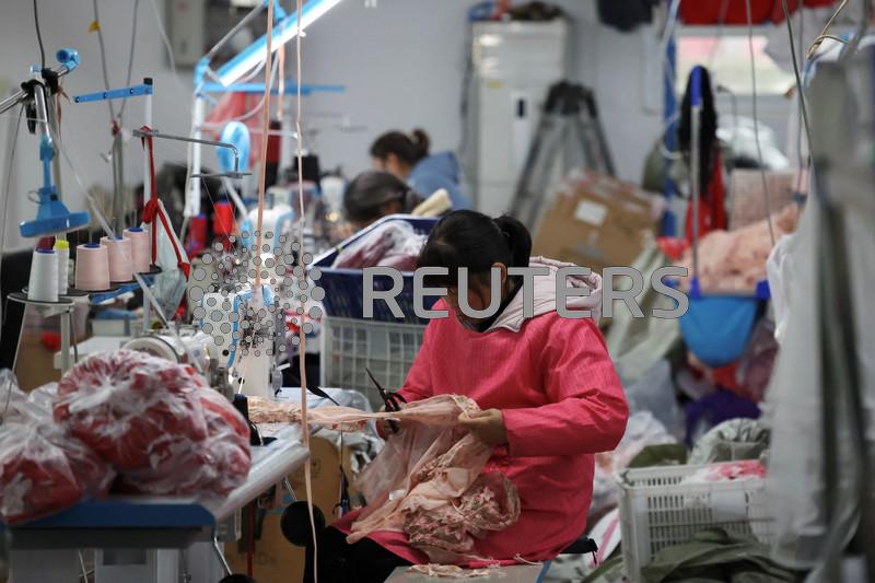 China factory activity grows more slowly, services recover