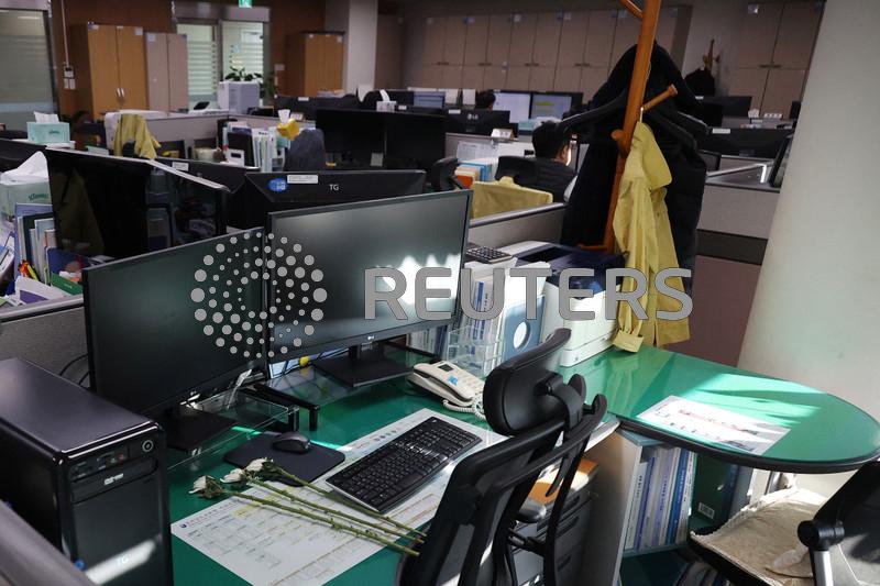 Empty desks and tears mark five colleagues killed in South Korean plane crash