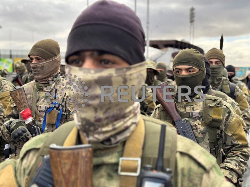 Syria appoints some foreign Islamist fighters to its military, sources say