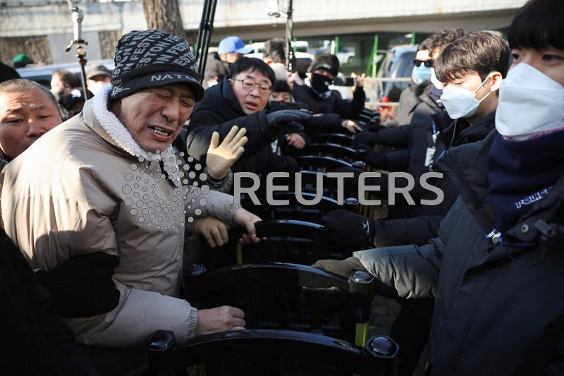 South Korea's Yoon, facing unprecedented arrest over martial law, vows to 'fight until end'