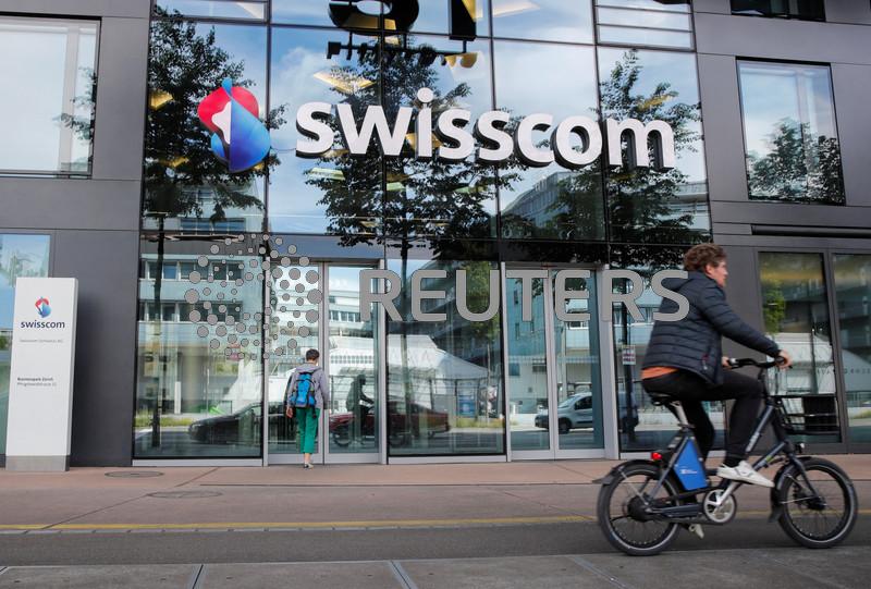 Swisscom revises down earnings outlook after Vodafone Italia acquisition complete