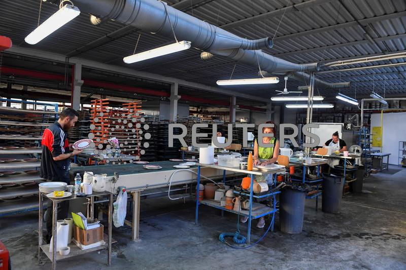 Italy's manufacturing stuck in downturn in December, PMI shows