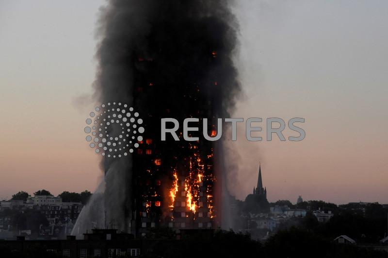 Exclusive-The Ghosts of Grenfell: No penalties for UK firms that used deadly building material