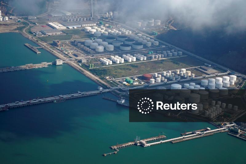 Oil prices edge down on US inventory build, OPEC forecast shift