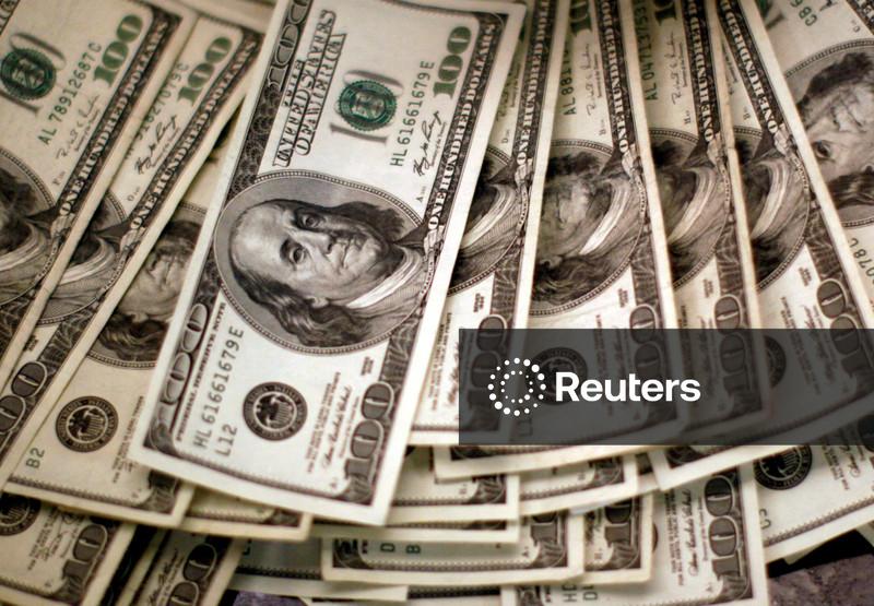 Dollar edges higher as investors brace for US data deluge