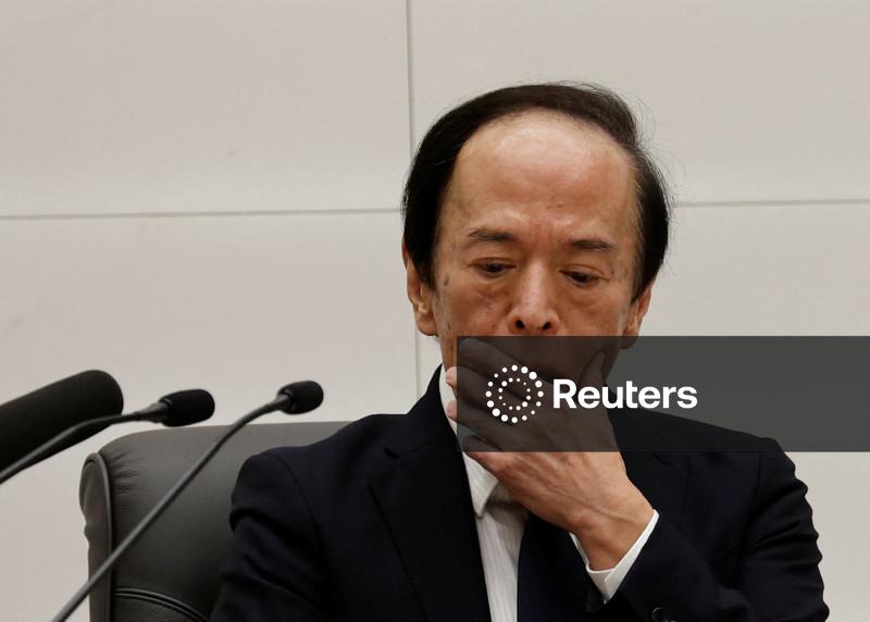 Bank of Japan drops fresh hints of near-term rate hike as yen slides