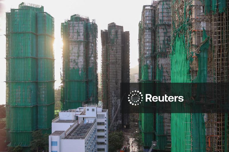 Hong Kong mourns victims of blaze that killed 128 and counting