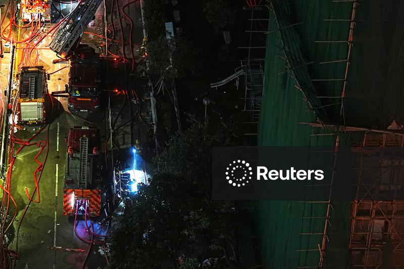 Mourners flock to site of deadly Hong Kong blaze as Beijing warns against protests