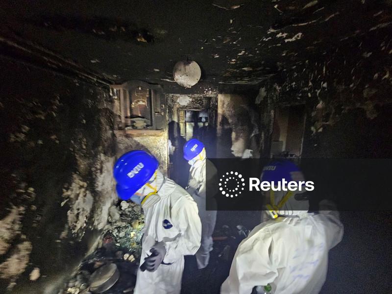 Police comb fire-ravaged Hong Kong apartments, death toll at 146