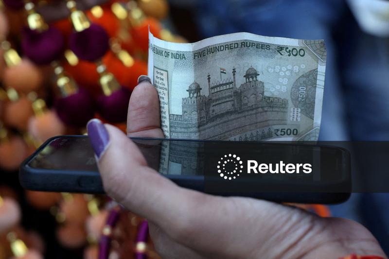 Rupee cracks below 90 to the dollar, hit by tariffs, capital outflows