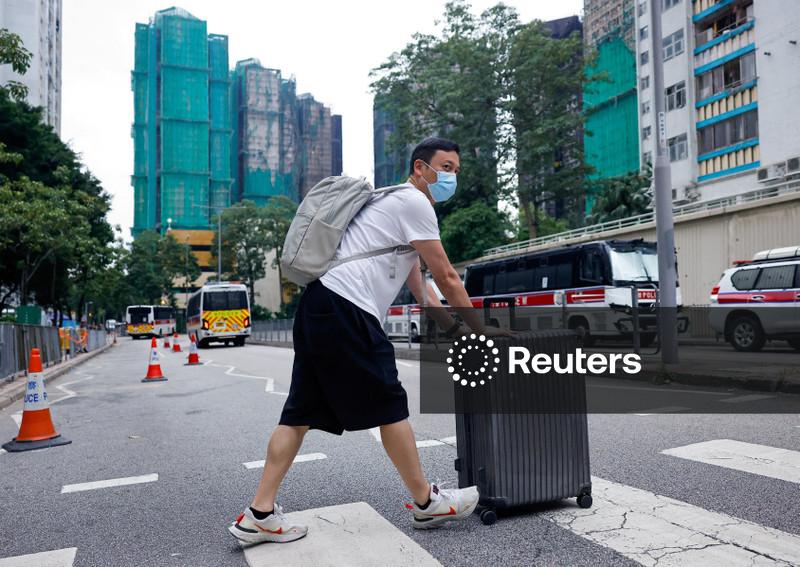 'Highly traumatised': Hong Kong presses ahead with elections after deadly fire