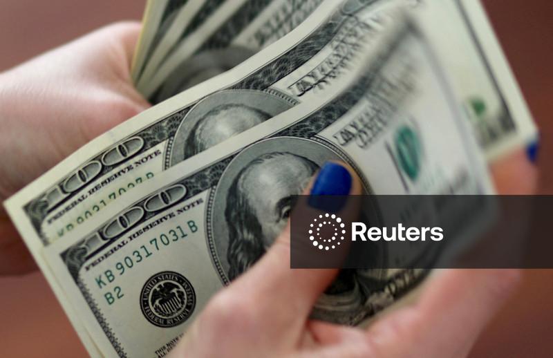 Dollar drifts near 2-1/2-month lows as labour data leaves rate path uncertain