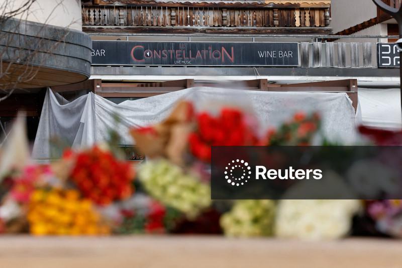 Stunned Swiss Alpine resort seeks solace together after deadly bar fire