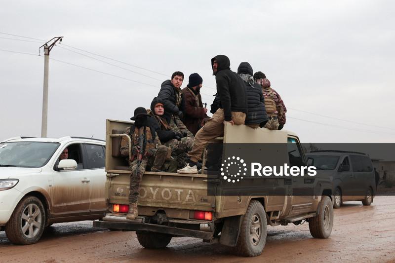 Syrian troops sweep northern towns as Kurdish fighters withdraw