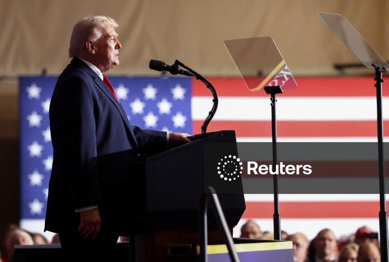 Battered dollar steadies after Trump triggers rout