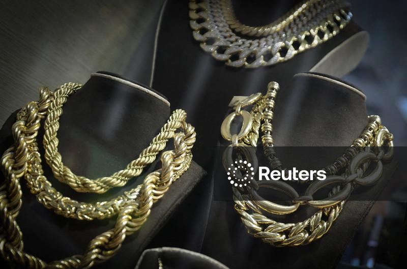 Gold plunges as bets of a more hawkish Fed chair rise; set for best month since 1980