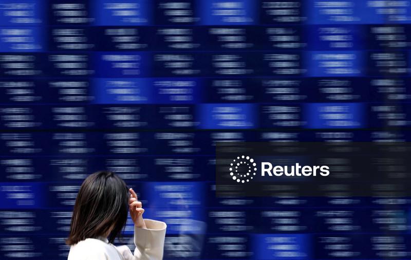 Stocks slide in Asia as metals melt down, earnings loom