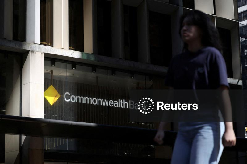 Australia's CBA first-half earnings hit record on market share gains, shares surge