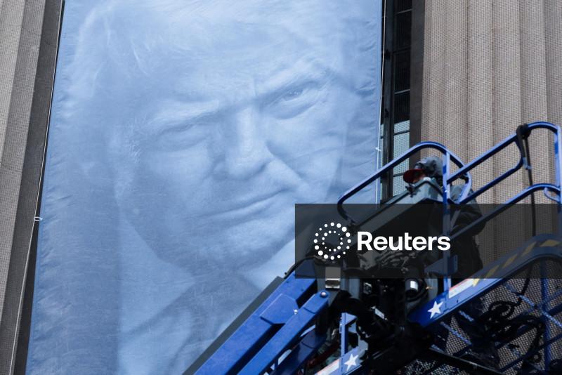 Banner of Donald Trump unfurled at Justice Department headquarters