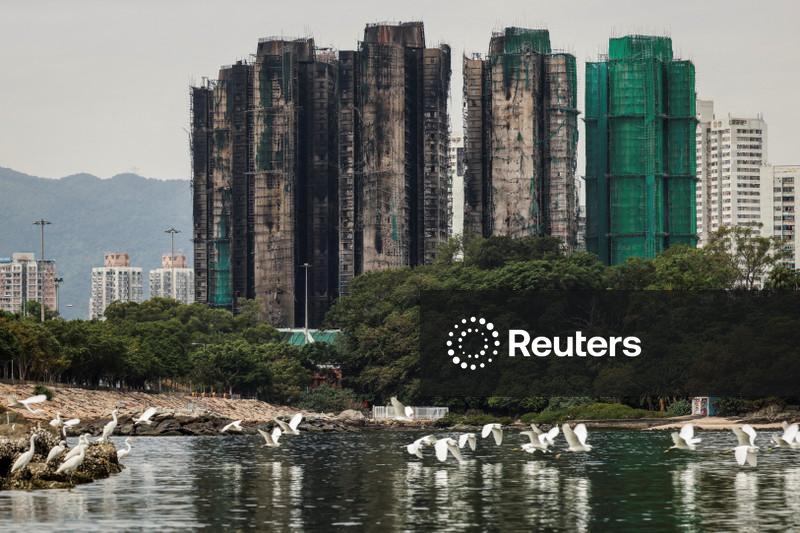 Hong Kong plans to buy homes devastated in deadly high-rise fire