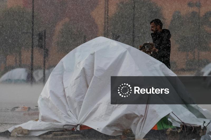 In heavy rain, Lebanese fleeing war huddle under makeshift shelters