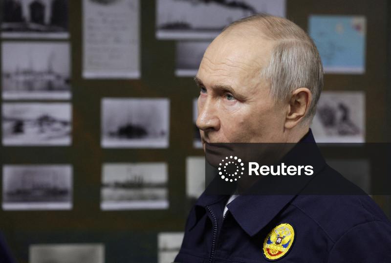 Russia's Putin visits Japan-claimed islands for first time; Tokyo protests