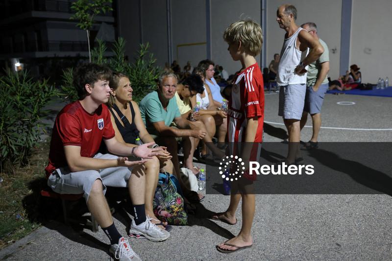Tourists flee as Greek wildfire hits resort; Croatia also fights blaze