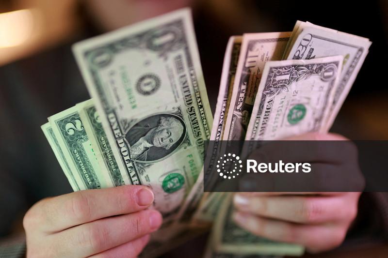 Dollar holds firm at nearly two-week high as Middle East hostilities lift oil
