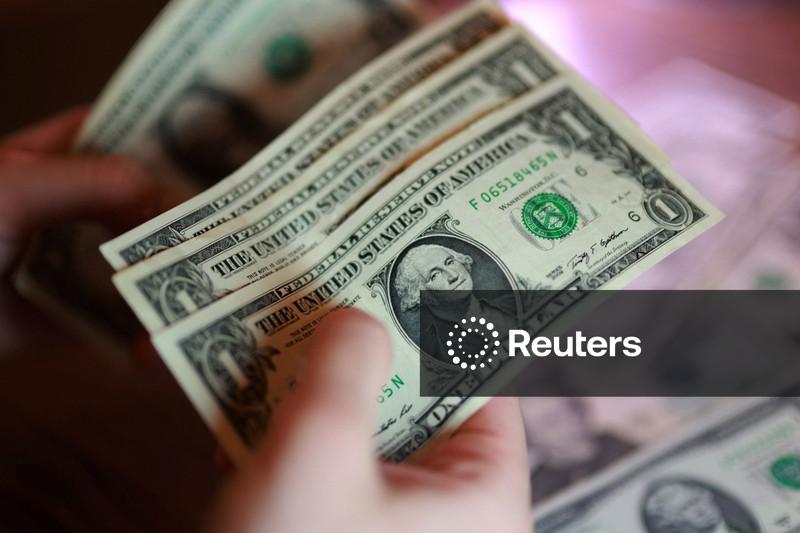 Dollar slips as oil prices sink, bond yields stabilise