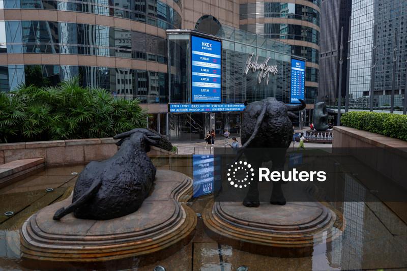 Asian stocks slip, Wall St and bonds benefit from oil dip