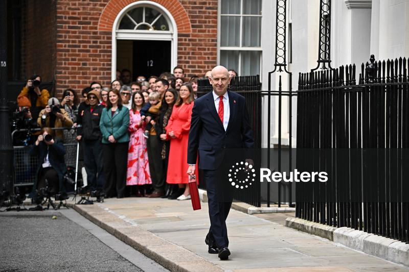 In first budget, UK's Healey tries to shelter households from economic storms